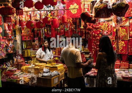 People select decorations at a shop at Chinatown district in Yangon, Myanmar on 19 January, 2020. Chinese Lunar New Year also known as the Spring Festival, falls on January 25 this year and marks the start of the Year of Rat. (Photo by Shwe Paw Mya Tin/NurPhoto) Stock Photo
