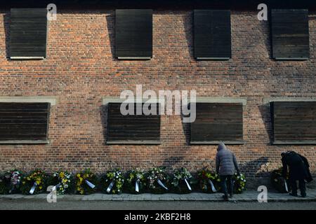 Organisers prepare wreaths near to the Wall of Death inside Auschwitz I former Nazi concentration camp gate, during a second day of 'Delegation to Auschwitz' event. On tuesday, January 21, 2020, in Auschwitz I concentration camp, Oswiecim, Poland. (Photo by Artur Widak/NurPhoto) Stock Photo