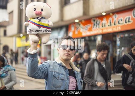 A man shows a pig allusive to the president of Colombia, Ivan Duque during national protests against Colombian President Ivan Duque on January 21, 2020 in Bogota, Colombia. (Photo by Daniel Garzon Herazo/NurPhoto) Stock Photo