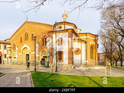 Milan, Italy - March 02, 2022: View of the Basilica di Sant-Eustorgio, with locals and visitors, in Milan, Lombardy, Northern Italy Stock Photo