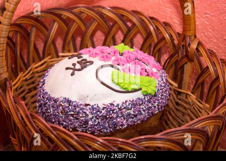 sweet Easter cake on the table in a basket in the room Stock Photo