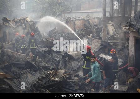 Bangladeshi firefighters extinguish a fire that broke out at Chalantika ...