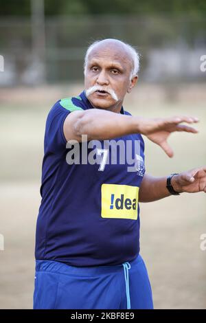 Training of FC Simla Youngs football club in Delhi, India on 2 April, 2018. Coach Tushar Dev gives instruction to players. The conditions in India for top football (soccer) are difficult. The heat - the season in lower competitions is only two months, ie in March and April. Poor surfaces and smog are also problematic. Simla Youngs is a club that was founded in 1936 and is one of the most traditional in India. Recently, clubs like Barcelona Gurgaon, Paris Saint Germain started to open their soccer academies, fees at such academies are not cheap. Trainers come from Europe for trainings, world ch Stock Photo