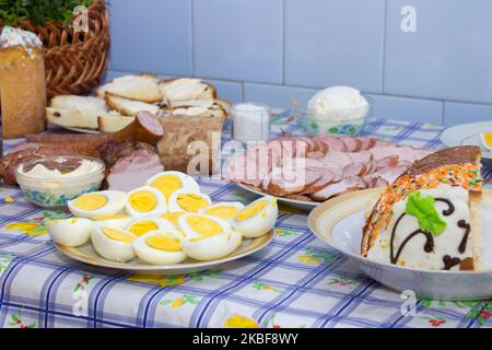 Easter table setting in green and orange tones Stock Photo