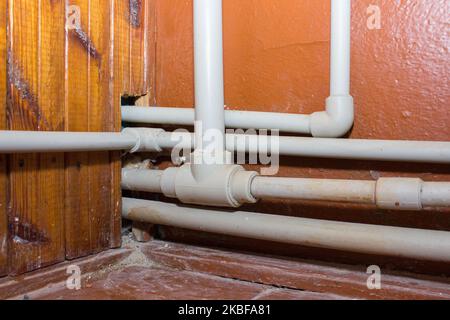 installation of plastic heating pipes in the house Stock Photo