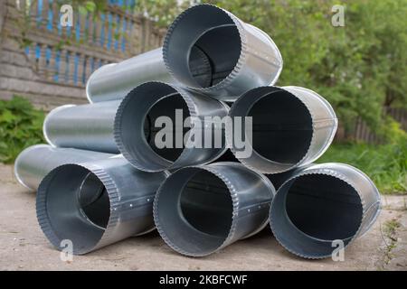 galvanized sheet metal pipe for drainage Zinc drain pipe Stock Photo