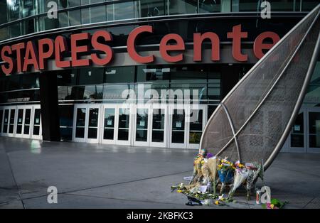 Flowers are laid in memorial for LA legend Kobe Bryant in front of an entrance at the Staples Center in Los Angeles, CA. on January 27, 2020. (Photo by Brent Combs/NurPhoto)
