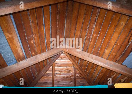 Old abandoned attic countryside, wooden beams above Stock Photo