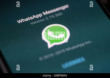 WhatsApp logo displayed on a phone screen, smartphone and keyboard are seen in this multiple exposure illustration. WhatsApp Messenger is a multiplatform mobile application that provides an encrypted instant messaging system belonging to Facebook, photo taken in Amsterdam, Netherlands on January 28, 2020 (Photo illustration by Nicolas Economou/NurPhoto) Stock Photo