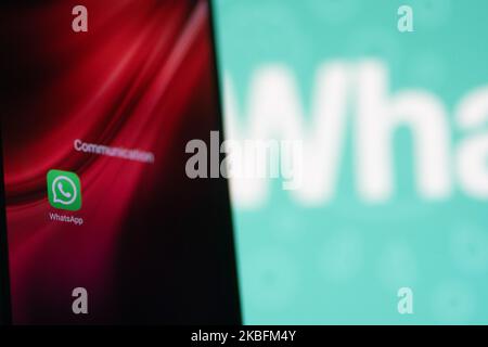 WhatsApp logo displayed on a phone screen, smartphone and keyboard are seen in this multiple exposure illustration. WhatsApp Messenger is a multiplatform mobile application that provides an encrypted instant messaging system belonging to Facebook, photo taken in Amsterdam, Netherlands on January 28, 2020 (Photo illustration by Nicolas Economou/NurPhoto) Stock Photo