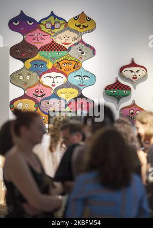 Hand made tapiserie (carpet) and cushions by Jain and Kriz pictured at the Shop Populaire during the Exhibition Summer of Love in Palais Populaire, Berlin, Germany on 19 June, 2019. The exhibition 'Summer of Love' in San Francisco in 1967 marked the climax of the American hippie movement. With over 150 exhibits, Palais Populaire in Berlin commemorated the era at the exhibition which took place from 20 June 2019 - 28 October 2019. The show portrayed the attitude to life of the hippie era by means of various exhibits: concert posters, fashion, photographs, record covers, light installations and  Stock Photo