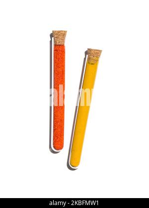 Potassium Ferricyanide and Organic Curcuma Powder in test tube with cork cap. Cosmetic chemicals ingredient on laboratory table. Top View Stock Photo