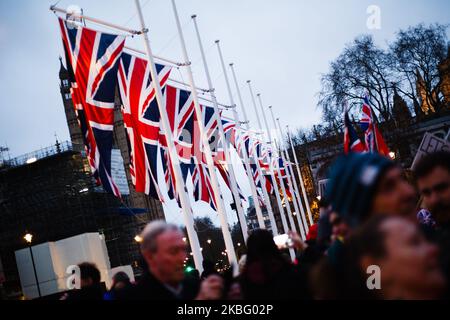 Union Jack flags hang in Parliament Square in London, England, on January 31, 2020. Britain's exit from the European Union, today at 11pm UK time (midnight in Brussels), comes more than three and a half years since the country's deeply polarising EU membership referendum, yet the moment brings to an end only the first stage of the Brexit saga, with the UK's future relationship with the bloc still to be negotiated. British Prime Minister Boris Johnson has insisted that the 11-month transition period, wherein arrangements continue practically unchanged, will not be extended past its December 31  Stock Photo