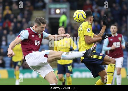 Burnley's James Tarkowski attempts to clear the ball away from Arsenals Pierre-Emerick Aubameyang during the Premier League match between Burnley and Arsenal at Turf Moor, Burnley on Sunday 2nd February 2020. (Photo by Tim Markland/MI News/NurPhoto) Stock Photo