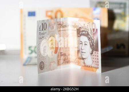 Currency, exchange rate, illustration photo mix of money, Sterling / British Pound GBP and Euro EUR banknotes paper bills and coin at close up pictures after the Brexit. Amsterdam, Netherlands - 02 02 2020 (Photo by Nicolas Economou/NurPhoto) Stock Photo