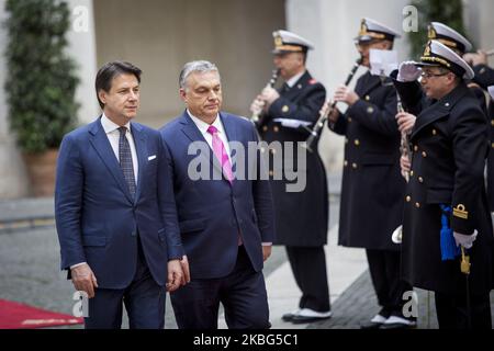 Italy's Prime Minister Giuseppe Conte (2R) and Hungarian Prime Minister Viktor Orban (R) stand attention during a welcoming ceremony at Chigi Palace in Rome, on February 3, 2020. (Photo by Christian Minelli/NurPhoto) Stock Photo