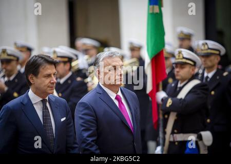 Italy's Prime Minister Giuseppe Conte and Hungarian Prime Minister Viktor Orban review a honor guard during a welcoming ceremony at Chigi Palace in Rome, on February 3, 2020. (Photo by Christian Minelli/NurPhoto) Stock Photo