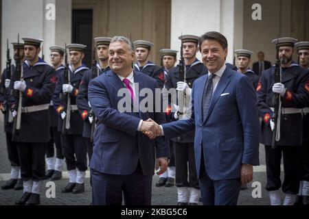 Italy's Prime Minister Giuseppe Conte shakes hands with Hungarian Prime Minister Viktor Orban during a welcoming ceremony at Chigi Palace in Rome, on February 3, 2020. (Photo by Christian Minelli/NurPhoto) Stock Photo