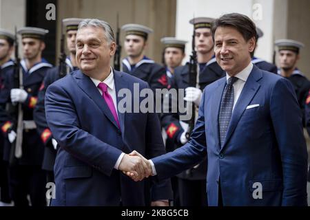 Italy's Prime Minister Giuseppe Conte shakes hands with Hungarian Prime Minister Viktor Orban during a welcoming ceremony at Chigi Palace in Rome, on February 3, 2020. (Photo by Christian Minelli/NurPhoto) Stock Photo