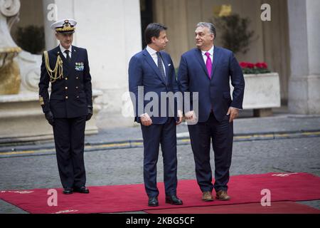 Italy's Prime Minister Giuseppe Conte (2R) and Hungarian Prime Minister Viktor Orban (R) stand attention during a welcoming ceremony at Chigi Palace in Rome, on February 3, 2020. (Photo by Christian Minelli/NurPhoto) Stock Photo