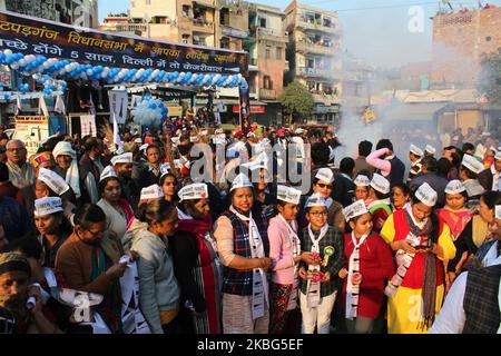 Supporters of Aam Aadmi Party cheer Delhi Chief Minister Arvind Kejriwal along with Deputy Chief Minister Manish Sisodia during a road show at Patparganj ahead of Delhi Assembly Elections on February 3, 2020 in New Delhi, India. The Delhi Assembly polls will be held on February 8 while the results will be announced on February 11. (Photo by Mayank Makhija/NurPhoto) Stock Photo