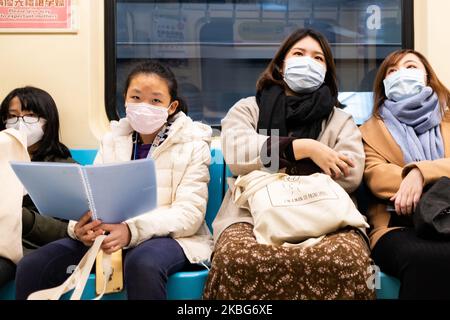 Taiwanese Citizens in Taipei Mass Rapid Transit (MRT) wearing a chirurgical protection mask in order to protect themself from Corona Virus (2019-nCoV) on 4 February 2020 in Tapei, Taiwan. (Photo by Jose Lopes Amaral/NurPhoto) Stock Photo
