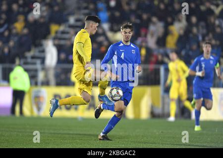 Dennis Man of Romania U21 in action against Juhani Pikkarainen of Finland U21 during the game of UEFA U21 championship between Romania U21 v Finland U21, in Voluntari, Romania, on November 14, 2019. (Photo by Alex Nicodim/NurPhoto) Stock Photo