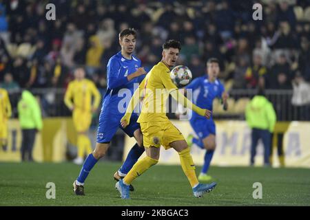 Dennis Man of Romania U21 in action against Juhani Pikkarainen of Finland U21 during the game of UEFA U21 championship between Romania U21 v Finland U21, in Voluntari, Romania, on November 14, 2019. (Photo by Alex Nicodim/NurPhoto) Stock Photo