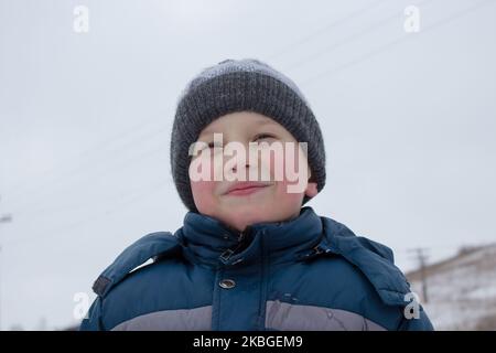 portrait of a little boy in winter clothes