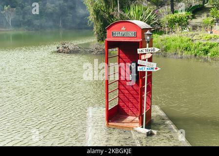 Da Lat, Vietnam - 2 November 2022: Telephone booth inside of water of Xuan Huong Lake Stock Photo