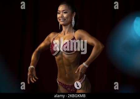 Female bodybuilding athlete competes in the Myanmar National Championship Bodybuilding and Physique Sports Competition in Yangon on February 9, 2020. (Photo by Shwe Paw Mya Tin/NurPhoto) Stock Photo