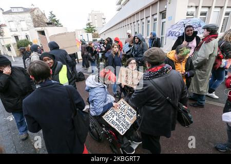 Protestors demonstrate for a greater inclusion of people with disabilies in front of the Departemental Center for Disabled Persons (Maison départementale des personnes handicapées MDPH) in Nanterre, in the inner suburbs of Paris, on February 11, 2020, the day when a National Conference on Disability (CNH) is held at the Élysée Palace,chaired by the French president Emmanuel Macron . (Photo by Michel Stoupak/NurPhoto) Stock Photo