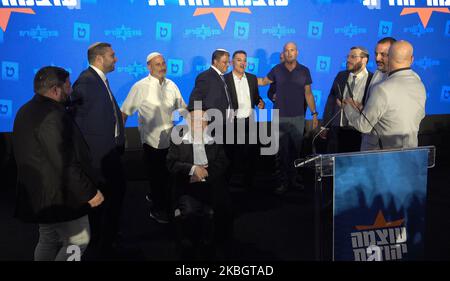 Far right-wing lawmaker Itamar Ben-Gvir, head of the Otzma Yehudit (Jewish power) dance with members of his party around Rabbi Dov Lior, an influential figure within the national religious community, who is known for his extremist religious rulings and rhetoric, at the party's campaign headquarters, on November 1, 2022 in Jerusalem, Israel. Rabbi Lior was arrested in 2011 on suspicion of inciting violence for endorsing a controversial religious book, the King's Torah, that gives Jews permission to kill innocent non-Jews, including children during wartime. Stock Photo