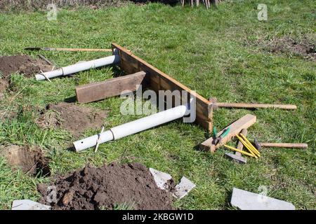bench on the grass with carpentry tools Stock Photo