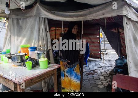 A survivor mother is active in her emergency tent at the Agung Mosque shelter in Palu, Central Sulawesi, Indonesia on February 13, 2020. Hundreds of disaster victims who still survive in the emergency tents claimed up to one and a half years of earthquake, tsunami and liquefaction disasters in Palu, Sigi, and Donggala districts they have not received social security assistance worth Rp 10,000 per person per day for two months. They also do not know whether they will get temporary or permanent shelter after their homes were destroyed by the disaster on September 28, 2018. (Photo by Basri Marzuk Stock Photo