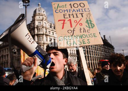 Young environmentalists take part in a 'climate strike' demonstration organised by the youth-led 'Fridays For Future' activist movement in Parliament Square in London, England, on February 14, 2020. The event marks one year since the first global wave of climate strike protests brought hundreds of thousands of schoolchildren onto the streets in cities around the world to call for greater action from governments to tackle the climate crisis. Several such coordinated global events have since been held, with worldwide climate activism over the past year further bolstered by the tandem growth of t Stock Photo