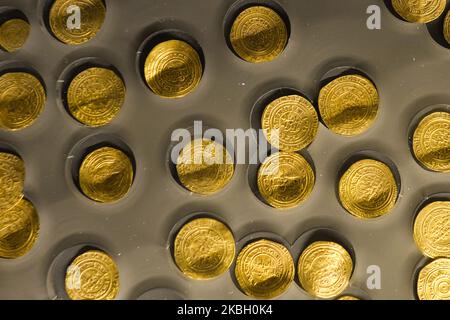 Gold dinar and 1/4 dinars, part of a large hoard of 2,700 coins found on the seabed in the Caesarea harbor. On Sunday, 9 February 2020, in Tel Aviv, Israel. (Photo by Artur Widak/NurPhoto) Stock Photo