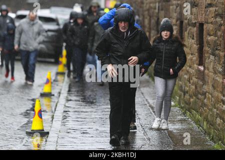 Fans arrive at the ground as Storm Dennis hits the UK ahead of the Scottish Premier League match between Hearts and Hamilton at Tynecastle park on 15 February, 2020 in Edinburgh, Scotland. (Photo by Ewan Bootman/NurPhoto) Stock Photo