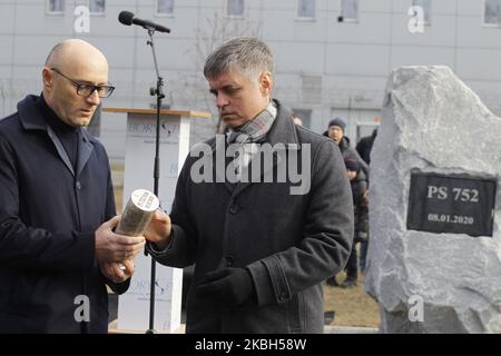 Minister of Foreign Affairs Vadym Prystaiko (R) and president of Ukraine International Airlines (UIA) Yevhenii Dykhne (L) hold the capsule with debris of the UIA PS752 plane, during a ceremony of a foundation stone for a future memorial and the square to memory the victims of the Ukraine International Airlines flight PS752 plane crash, at the Boryspil International Airport near Kyiv, Ukraine, on 17 February, 2020. The Boeing 737-800 of the Ukraine International Airlines was shot down shortly after takeoff from Tehran Imam Khomeini International Airport on 8 January 2020. (Photo by STR/NurPhoto Stock Photo