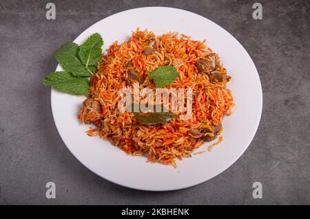 Chicken biryani rice dish with mint. Top view. Pakistani and Indian dish. Stock Photo