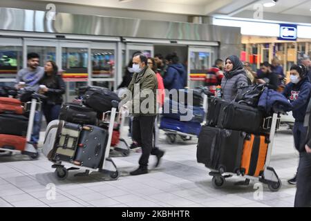 Passengers at Pearson International Airport in Ontario, Canada. Some passangers are wearing masks to protect from the novel coronavirus (COVID-19). Pearson International Airport is Canada's largest and busiest airport. (Photo by Creative Touch Imaging Ltd./NurPhoto) Stock Photo