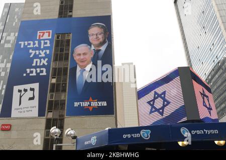 An election campaign poster for far-right Otzma Yehudit (Jewish Power) with images of party leader Itamar Ben-Gvir behind Benjamin Netanyahu, Israeli PM and Likud Party leader. Israelis head to the polls for the third election in less than a year on March 2nd. On Tuesday, February 25, 2020, in Ramat Gan, Tel Aviv District, Israel. (Photo by Artur Widak/NurPhoto) Stock Photo