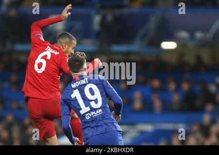 Thiago (Bayern Munich) and Mason Mount (Chelsea) battle for the ball during the 2019/20 UEFA Champions League 1/8 playoff finale game between Chelsea FC (England) and Bayern Munich (Germany) at Stamford Bridge. (Photo by Federico Guerra Moran/NurPhoto) Stock Photo