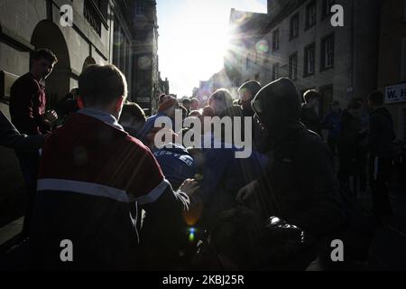 Boys chase after the leather ball during the annual game of hand ba’ that takes place in the Scottish town of Jedburgh in the Scottish Borders on February 27, 2020 in Jedburgh, United Kingdom. The game originating from the 1700’s consists of two teams, the ‘Uppies’ (born in the South of Jedburgh) and the ‘Doonies’ (born in the north of Jedburgh). The aim is to score goals at either end of the town by carrying a leather ball with ribbons past certain landmarks. The leather ball is used to represent an Englishman’s head with was originally used. (Photo by Ewan Bootman/NurPhoto) Stock Photo