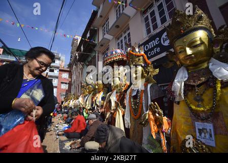 Nepalese Buddhist lining to offer rituals and holy grains towards the statue of Dipankar Buddha during a ritual procession of the Samyak Mahadan festival in Lalitpur, Nepal on Thursday, February 27, 2020. Once in five years total number of 126 Dipankar Buddha from different places gathered in Lalitpur for ritual procession. (Photo by Narayan Maharjan/NurPhoto) Stock Photo