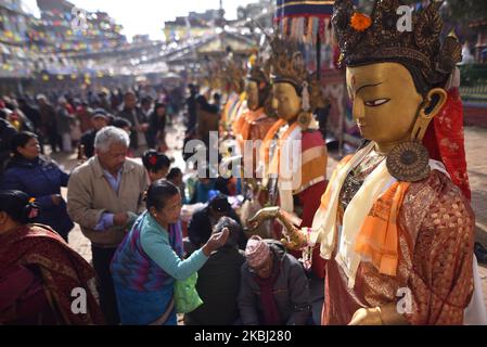 Nepalese Buddhist lining to offer rituals and holy grains towards the statue of Dipankar Buddha during a ritual procession of the Samyak Mahadan festival in Lalitpur, Nepal on Thursday, February 27, 2020. Once in five years total number of 126 Dipankar Buddha from different places gathered in Lalitpur for ritual procession. (Photo by Narayan Maharjan/NurPhoto) Stock Photo