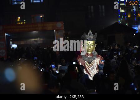 Nepalese Buddhist devotee carry a statue of Dipankar Buddha during a ritual procession of the Samyak Mahadan festival in Lalitpur, Nepal on February 26, 2020. Once in five years total number of 126 Dipankar Buddha from different places gathered in Lalitpur for ritual procession. (Photo by Narayan Maharjan/NurPhoto) Stock Photo