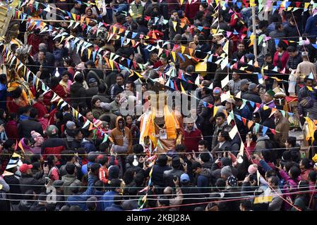 Nepalese Buddhist devotee carry a statue of Dipankar Buddha during a ritual procession of the Samyak Mahadan festival in Lalitpur, Nepal on Thursday, February 27, 2020. Once in five years total number of 126 Dipankar Buddha from different places gathered in Lalitpur for ritual procession. (Photo by Narayan Maharjan/NurPhoto) Stock Photo