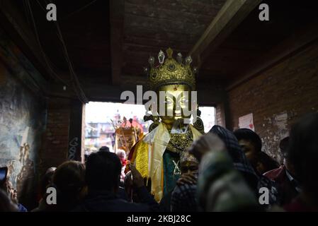 Nepalese Buddhist devotee carry a statue of Dipankar Buddha during a ritual procession of the Samyak Mahadan festival in Lalitpur, Nepal on Thursday, February 27, 2020. Once in five years total number of 126 Dipankar Buddha from different places gathered in Lalitpur for ritual procession. (Photo by Narayan Maharjan/NurPhoto) Stock Photo