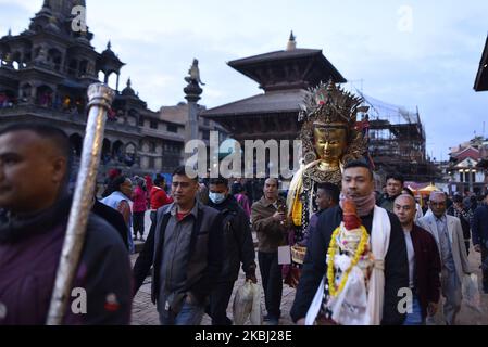 Nepalese Buddhist devotee carry a statue of Dipankar Buddha during a ritual procession of the Samyak Mahadan festival in Lalitpur, Nepal on Thursday, February 27, 2020. Once in five years total number of 126 Dipankar Buddha from different places gathered in Lalitpur for ritual procession. (Photo by Narayan Maharjan/NurPhoto) Stock Photo